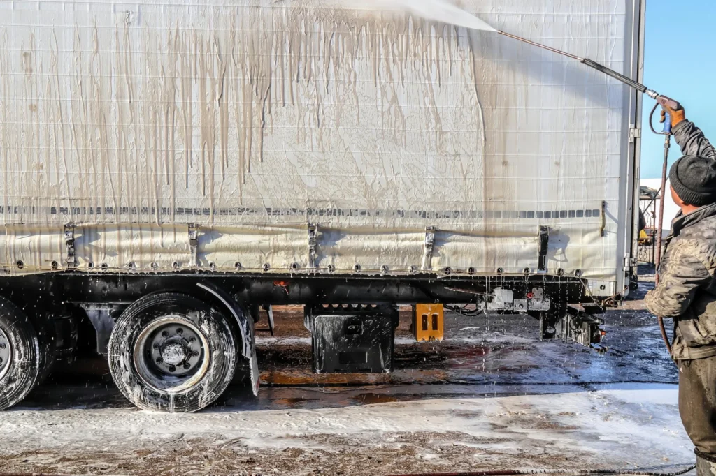 A fleet of trucks lined up, cleaned and ready after pressure washing