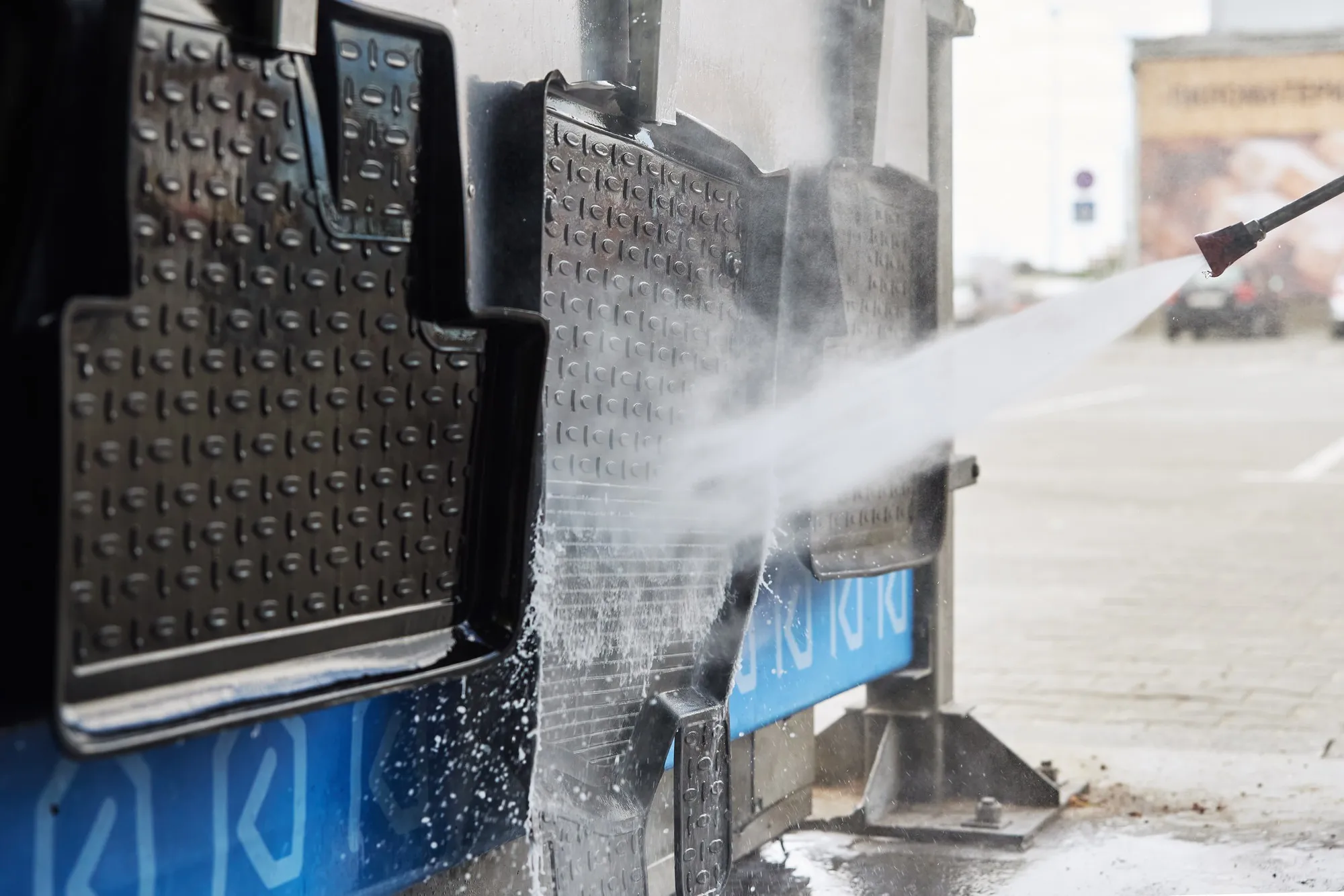 A side-by-side image showing fleet washing equipment and manual cleaning tools.