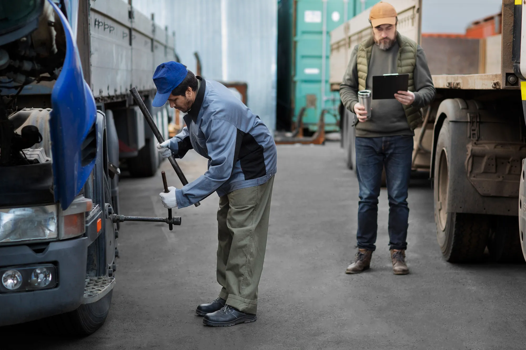 A team washing a truck fleet with high-pressure equipment.