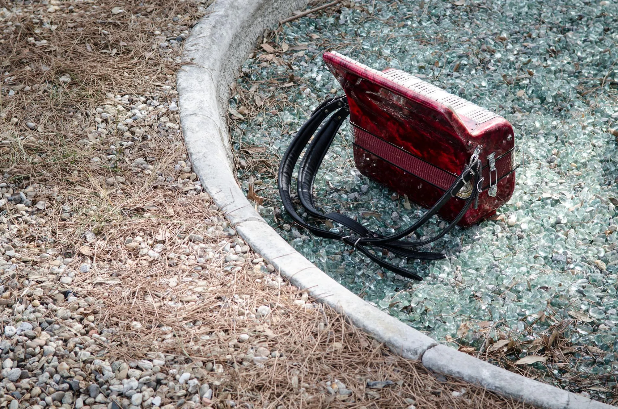 A technician using specialized equipment to clean a catch basin.